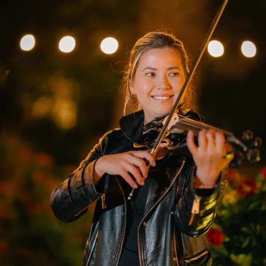 Maya Victoria performing at night event
