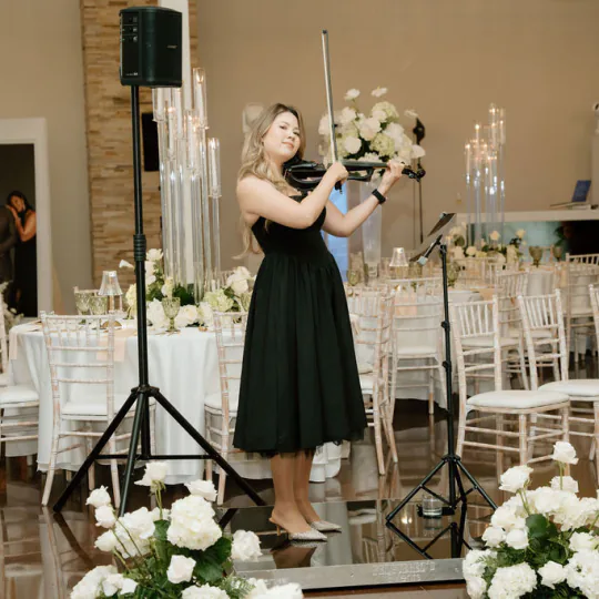 Maya Victoria performing at indoor wedding